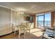 Inviting living area with ocean view, dining set, and comfortable sofa at 6900 N Ocean Blvd. # 1041, Myrtle Beach, SC 29577