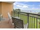 Condo balcony with patio furniture overlooking a lush green lawn and beach at 6900 N Ocean Blvd. # 222, Myrtle Beach, SC 29572