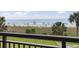 Beautiful beach view from the balcony with palm trees, beachgoers, and a lifeguard station at 6900 N Ocean Blvd. # 222, Myrtle Beach, SC 29572