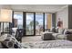 Comfortable living room with a sleeper sofa and a great view of the ocean from the balcony at 6900 N Ocean Blvd. # 222, Myrtle Beach, SC 29572