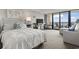 Comfortable main bedroom featuring a plush bed, and balcony access with an ocean view at 6900 N Ocean Blvd. # 222, Myrtle Beach, SC 29572