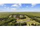 Aerial view of a home on a golf course with a pond and mature trees at 7005 Wellesley Ct., Murrells Inlet, SC 29576