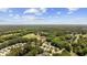 Aerial view of homes on a golf course near a pond and mature trees at 7005 Wellesley Ct., Murrells Inlet, SC 29576