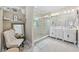 Bright bathroom features a double sink vanity, large glass shower, and decorative pebble flooring accents at 7005 Wellesley Ct., Murrells Inlet, SC 29576