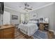 Comfortable bedroom with nautical decor, wood floors, and a window providing natural light at 7005 Wellesley Ct., Murrells Inlet, SC 29576