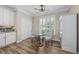 Cozy breakfast nook featuring a round table with seating near a window with plantation shutters at 7005 Wellesley Ct., Murrells Inlet, SC 29576