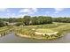 Picturesque golf course view with a pond and mature trees at 7005 Wellesley Ct., Murrells Inlet, SC 29576