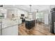 Bright kitchen with white cabinets, granite countertops, stainless steel appliances, and a central island at 7005 Wellesley Ct., Murrells Inlet, SC 29576