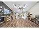 Spacious living room with skylights and barn doors leading to another stylish living area at 7005 Wellesley Ct., Murrells Inlet, SC 29576