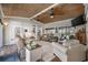 Inviting sunroom with wood ceiling, large windows, and cozy seating for relaxation and entertaining at 7005 Wellesley Ct., Murrells Inlet, SC 29576