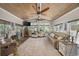 Inviting sunroom with wood ceiling, large windows, and cozy seating, perfect for relaxation at 7005 Wellesley Ct., Murrells Inlet, SC 29576
