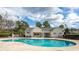 Community pool with a clubhouse and a large sundeck with lounge chairs at 7005 Wellesley Ct., Murrells Inlet, SC 29576