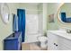 This bathroom is painted green and has a shower, toilet and a vanity with sink at 701 Salleyport Dr. # 1110, Myrtle Beach, SC 29579