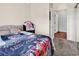 Carpeted bedroom featuring a bed with a gray headboard and doorway leading to other rooms at 701 Salleyport Dr. # 1110, Myrtle Beach, SC 29579