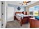 Bedroom with wood furnishings, ceiling fan and natural light from a large window at 701 Salleyport Dr. # 1110, Myrtle Beach, SC 29579