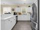 Bright open kitchen with white cabinets, stainless appliances and tiled floors at 701 Salleyport Dr. # 1110, Myrtle Beach, SC 29579