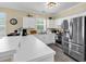 Bright kitchen featuring stainless steel appliances, white cabinets, and a breakfast bar at 701 Salleyport Dr. # 1110, Myrtle Beach, SC 29579