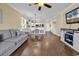 Inviting open-plan living room and dining area, with kitchen view and hardwood flooring at 701 Salleyport Dr. # 1110, Myrtle Beach, SC 29579