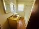 Bathroom with a vanity, tub and shower, and a window at 704 W Alder St., Andrews, SC 29510
