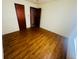Empty bedroom featuring light-colored walls and wood flooring at 704 W Alder St., Andrews, SC 29510