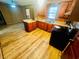 Well-lit kitchen featuring wood cabinets, laminate countertops, laminate floors, and stainless steel oven at 704 W Alder St., Andrews, SC 29510