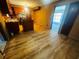Cozy kitchen featuring wood cabinets, wood paneled walls, and wood flooring at 704 W Alder St., Andrews, SC 29510