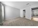 Bedroom showcasing a neutral color palette and view into the bathroom at 755 Burcale Rd. # E-3, Myrtle Beach, SC 29579