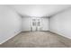This is an image of a bedroom with new carpet, neutral walls, and a bright window at 755 Burcale Rd. # E-3, Myrtle Beach, SC 29579