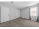 Neutral bedroom offers natural light from window, plush carpeting, and a closet for storage at 755 Burcale Rd. # E-3, Myrtle Beach, SC 29579