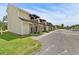 Exterior view of tan condo units with small private balconies and well maintained grass at 755 Burcale Rd. # E-3, Myrtle Beach, SC 29579
