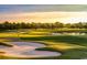 Scenic golf course with sand traps, lush fairways, and trees under a beautiful sky at 755 Burcale Rd. # E-3, Myrtle Beach, SC 29579