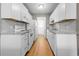 Galley kitchen with white cabinets, appliances, and grey countertops at 755 Burcale Rd. # E-3, Myrtle Beach, SC 29579