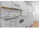 Kitchen featuring white appliances, subway tile backsplash and granite countertops for a clean look at 755 Burcale Rd. # E-3, Myrtle Beach, SC 29579