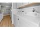 Bright laundry room featuring an Amana washer and dryer with white cabinets above at 755 Burcale Rd. # E-3, Myrtle Beach, SC 29579