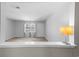 Open living room showcasing neutral paint, window, and carpet at 755 Burcale Rd. # E-3, Myrtle Beach, SC 29579
