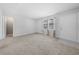 Bright living room with carpet, a front door, and access to other rooms in the house at 755 Burcale Rd. # E-3, Myrtle Beach, SC 29579