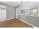 Living area with hardwood floors leads into the kitchen and hallway to the bathroom at 755 Burcale Rd. # E-3, Myrtle Beach, SC 29579