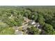 Aerial view of a neighborhood surrounded by lush green trees at 77 Redwing Ct., Pawleys Island, SC 29585