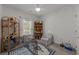 Bright bedroom filled with natural light features a pet cage and shelving with toys and books at 77 Redwing Ct., Pawleys Island, SC 29585