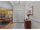 Welcoming entryway with a neutral color scheme, decorative rug, and a glimpse into the adjacent dining room at 77 Redwing Ct., Pawleys Island, SC 29585