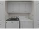 Laundry room features Maytag washer and dryer, plus storage at 77 Redwing Ct., Pawleys Island, SC 29585