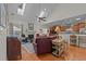 Spacious living room with vaulted ceilings, hardwood floors, fireplace and plenty of natural light from the skylights at 77 Redwing Ct., Pawleys Island, SC 29585