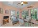 Comfortable sunroom offers lots of light, wicker furniture, and tile floors at 77 Redwing Ct., Pawleys Island, SC 29585