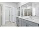 Primary bathroom with double sink vanity, large mirror, and glass enclosed shower at 8253 Vibrant Loop, Longs, SC 29568