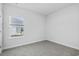 Bright bedroom with a window for natural light and plush carpeting at 8253 Vibrant Loop, Longs, SC 29568