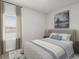 Comfortable bedroom featuring a cozy bed, neutral tones, and natural light from the window at 8253 Vibrant Loop, Longs, SC 29568