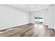 Spacious bedroom with sliding glass doors opening to the backyard space and natural light at 8253 Vibrant Loop, Longs, SC 29568