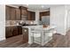 Stylish kitchen featuring a central island with seating and stainless steel appliances at 8253 Vibrant Loop, Longs, SC 29568