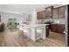 Modern kitchen with island, stainless appliances, and a dining area at 8253 Vibrant Loop, Longs, SC 29568