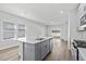 Kitchen with large island and sliding glass doors to the backyard for outdoor access at 8253 Vibrant Loop, Longs, SC 29568